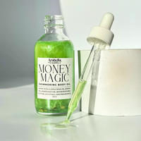 A close-up of Money Magic Shimmer Oil, highlighting its glimmering gold color in an elegant glass bottle.